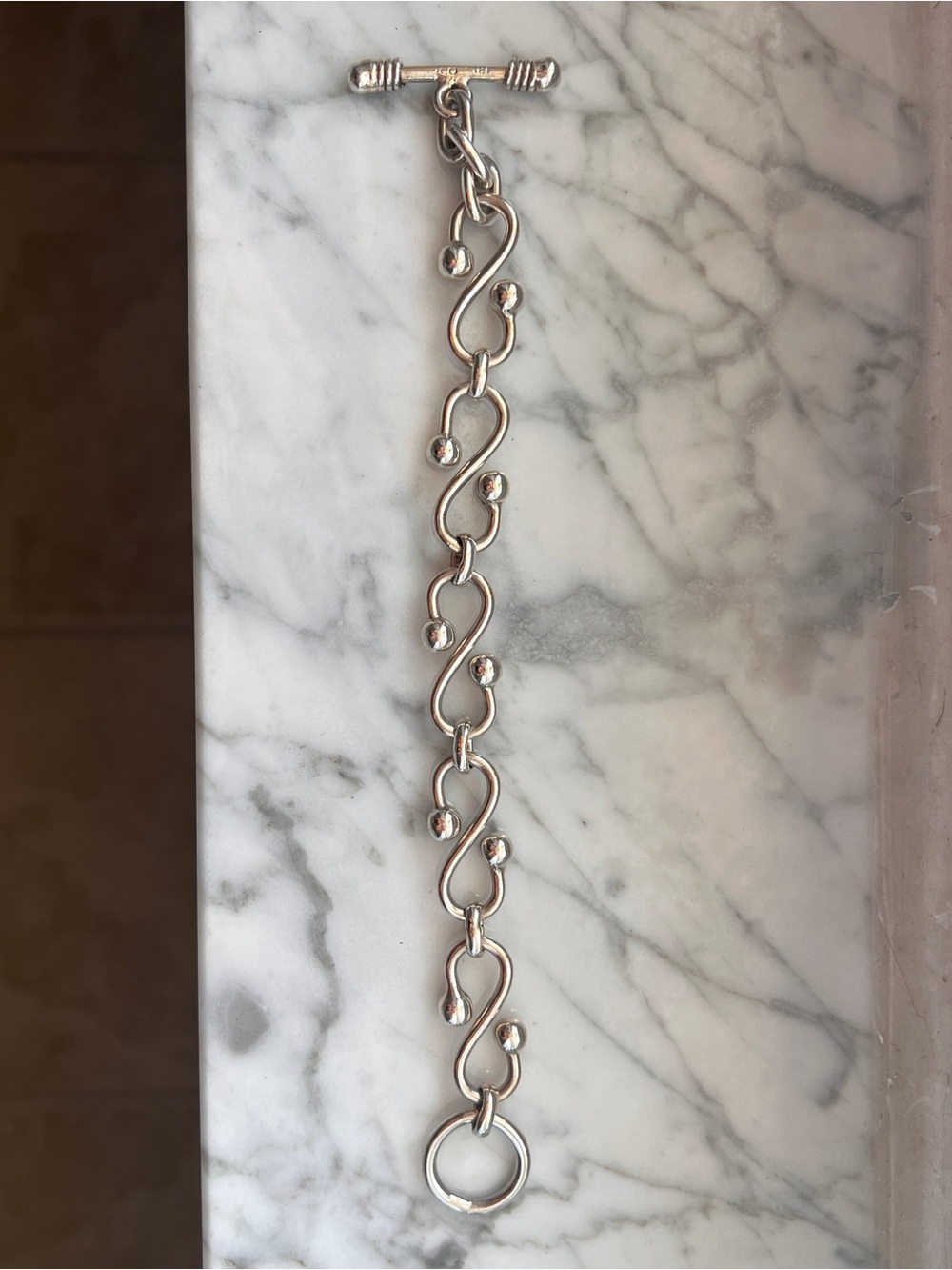 Silver 7.5 inch S-Shaped Solid Toggle Bracelet with Polished Ball Accents - Picture 2 of 11